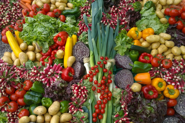 A colourful assortment of fresh whole vegetables.
