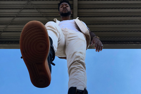 Low-angle shot of a man taking a confident step forward